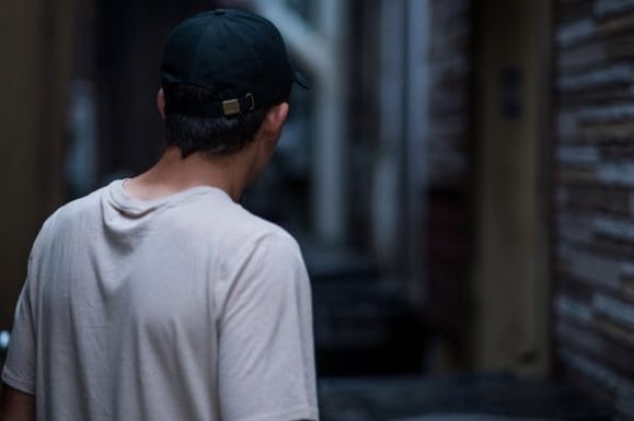 man with cap from behind